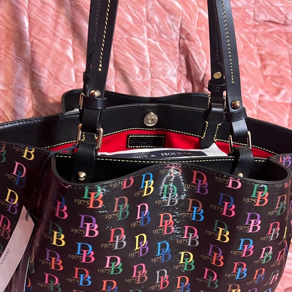 BRAND NEW!! DOONEY AND BOURKE MULTI FLYNN OPENED NEVER CARRIED NEVER REGISTERED! - Picture 3 of 6